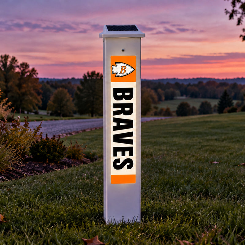 Belmont Braves Solar Glow Post lit up at dusk in a country yard.