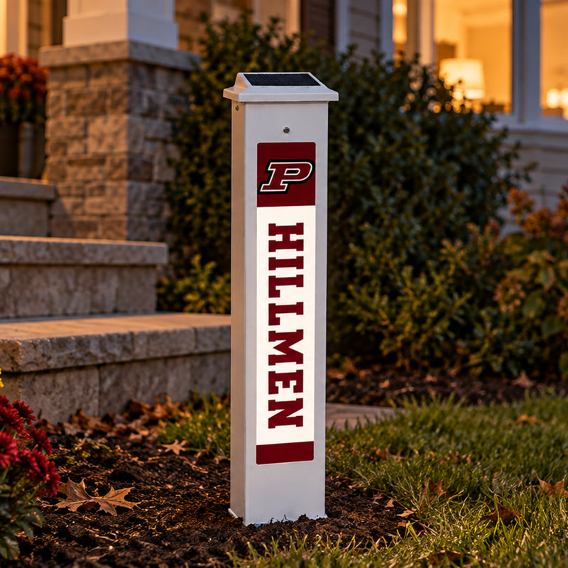 Platteville Hillmen Solar Glow Post lit up at dusk.