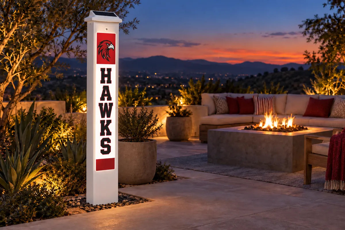A FanPillar Solar Glow Post glowing on a patio at dusk