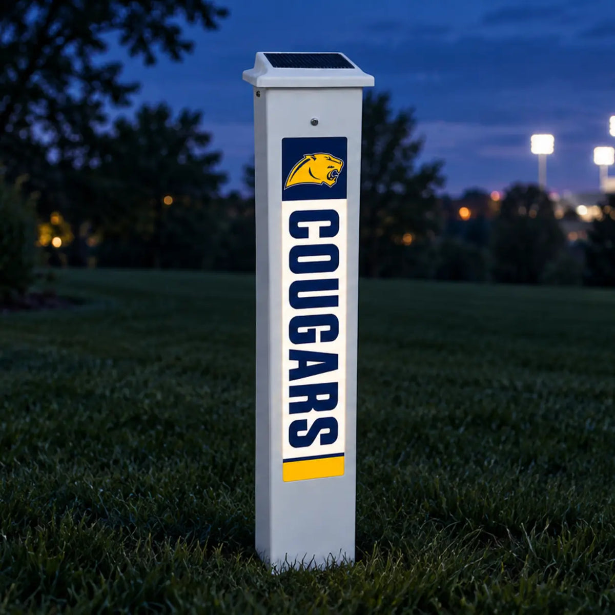 Cascade Cougars Solar Glow Post lit up at dusk.