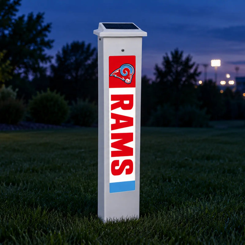 Dubuque Senior Rams Solar Glow Post lit up at dusk.