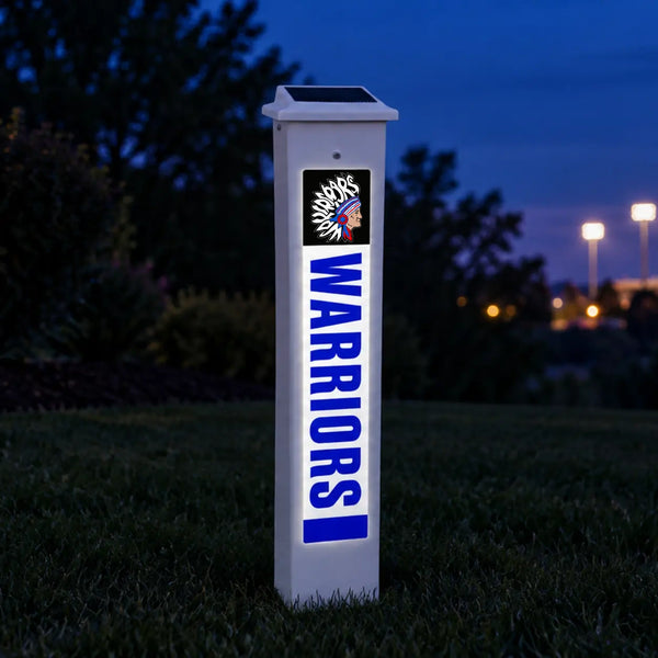 East Dubuque Warriors Solar Glow Post lit up at dusk.