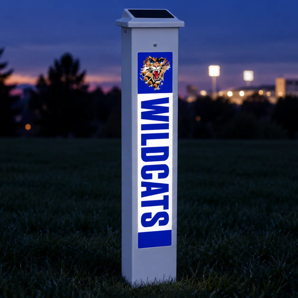 Southwestern Wildcats Solar Glow Post lit up at dusk.